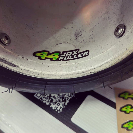 Custom kart racing wheel with green number 44 Jax Fuller sticker, motorsport graphics